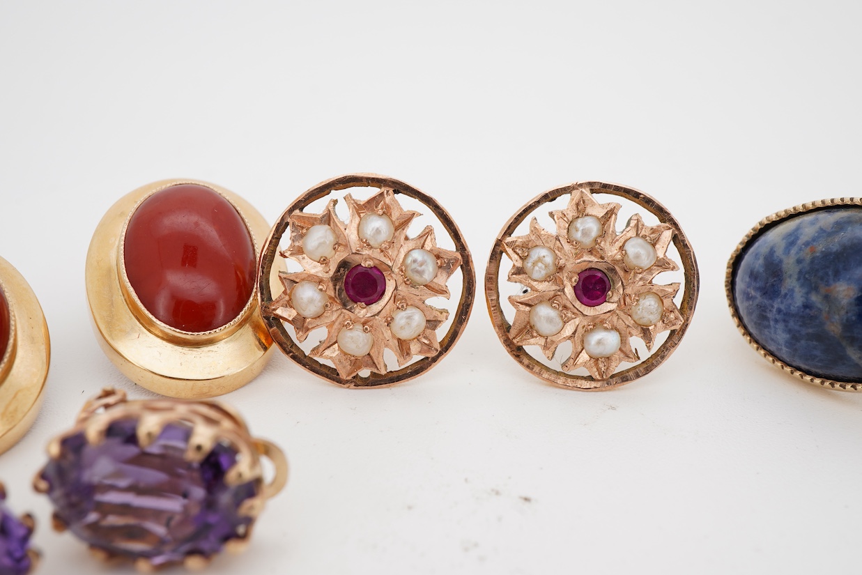Three assorted modern pairs of ear clips including oval 750 yellow metal and carnelian, 19mm, unmarked yellow metal synthetic ruby and seed pearl and unmarked yellow metal and amethyst, together with a pair of 9ct and so